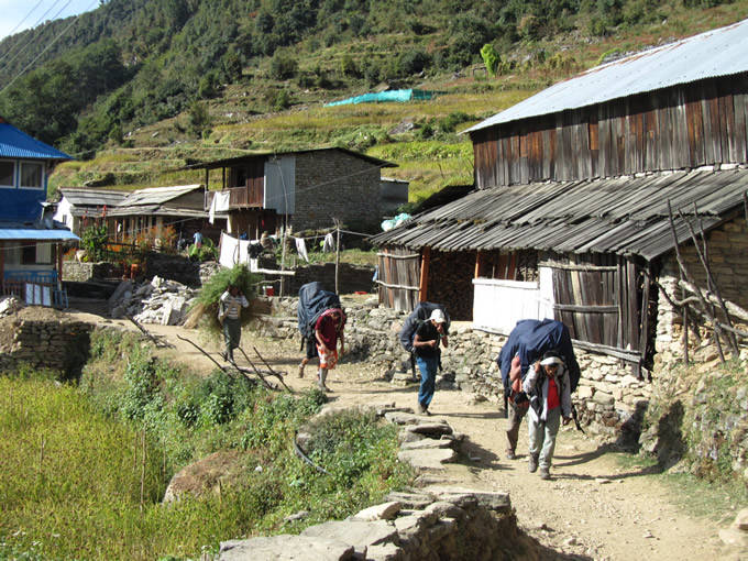 Sherpa's carrying a huge load